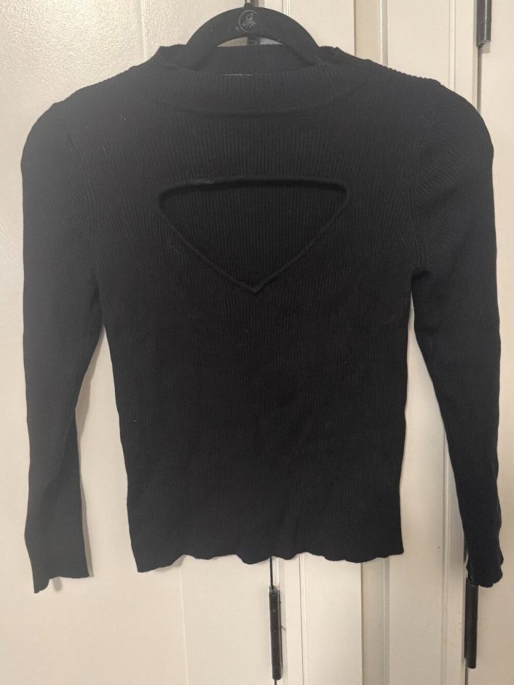 Black long sleeve top with cutout detail